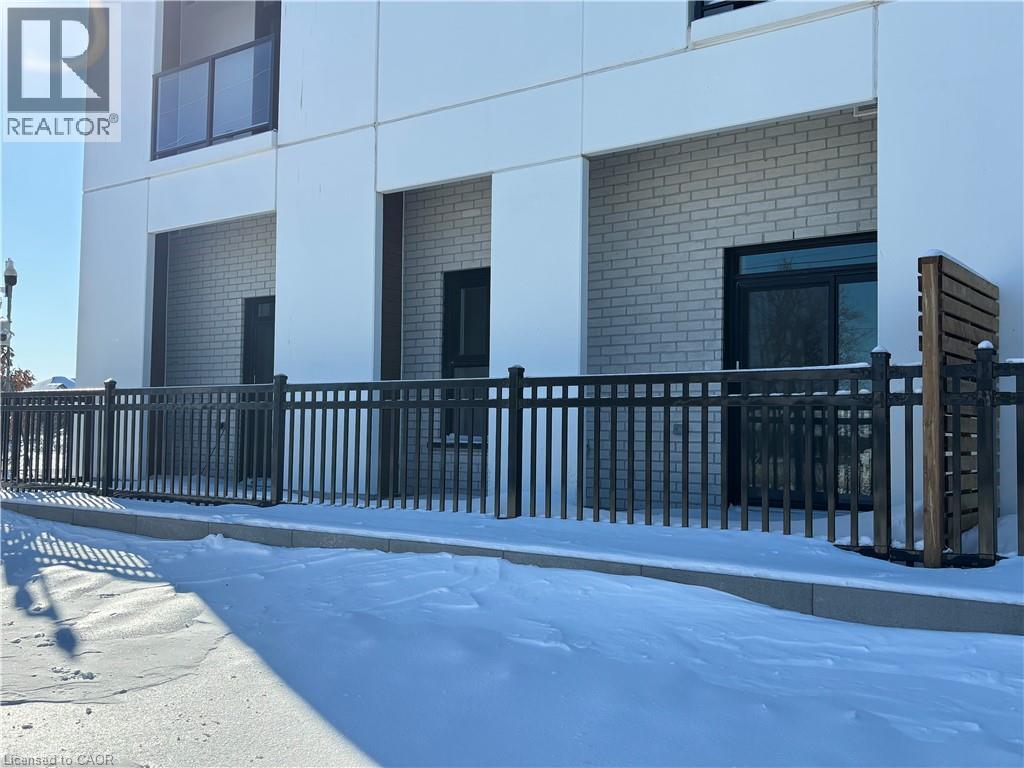 A building with a black fence in front of it.