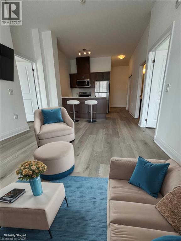 A living room with a couch, chair, and a coffee table.