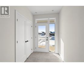A white door with a glass window is in a room with white walls.