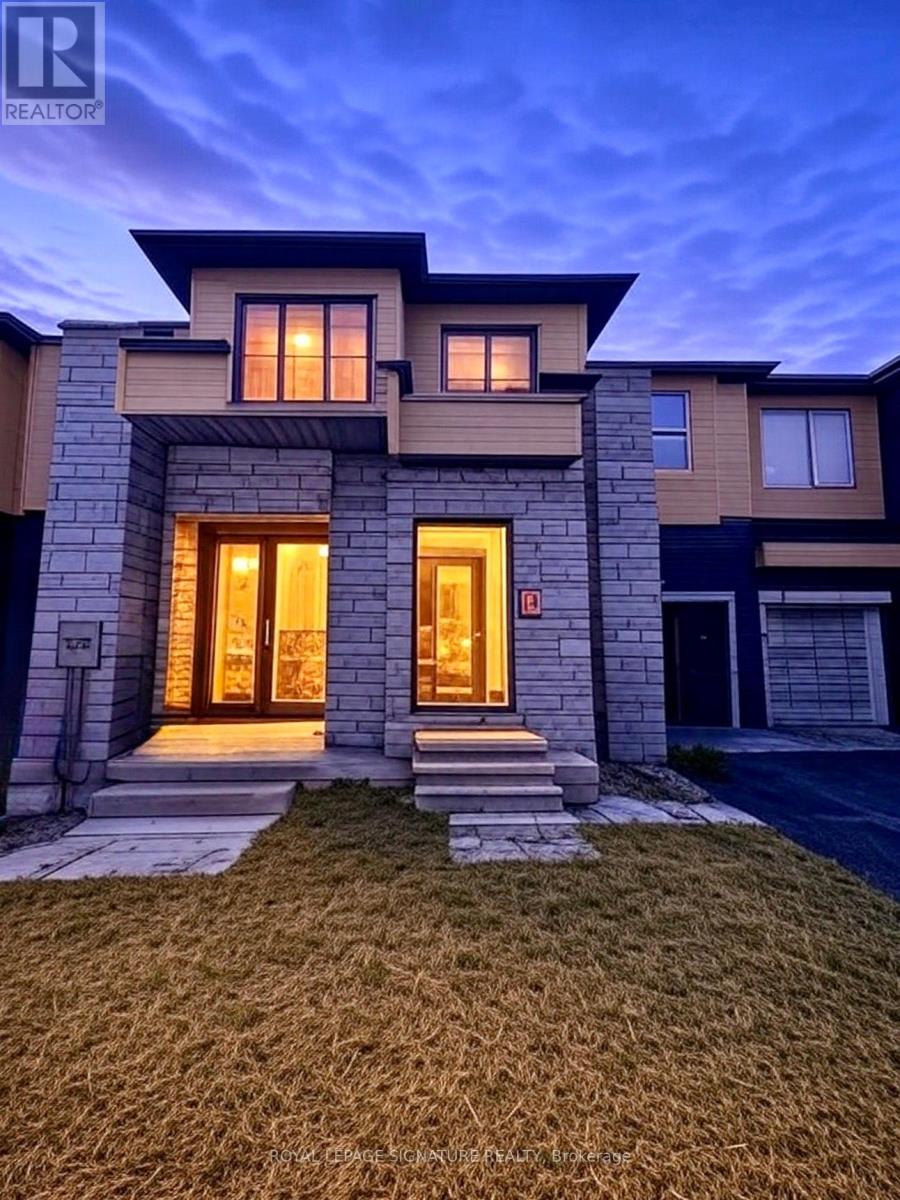 A modern house with a large front yard and a garage.