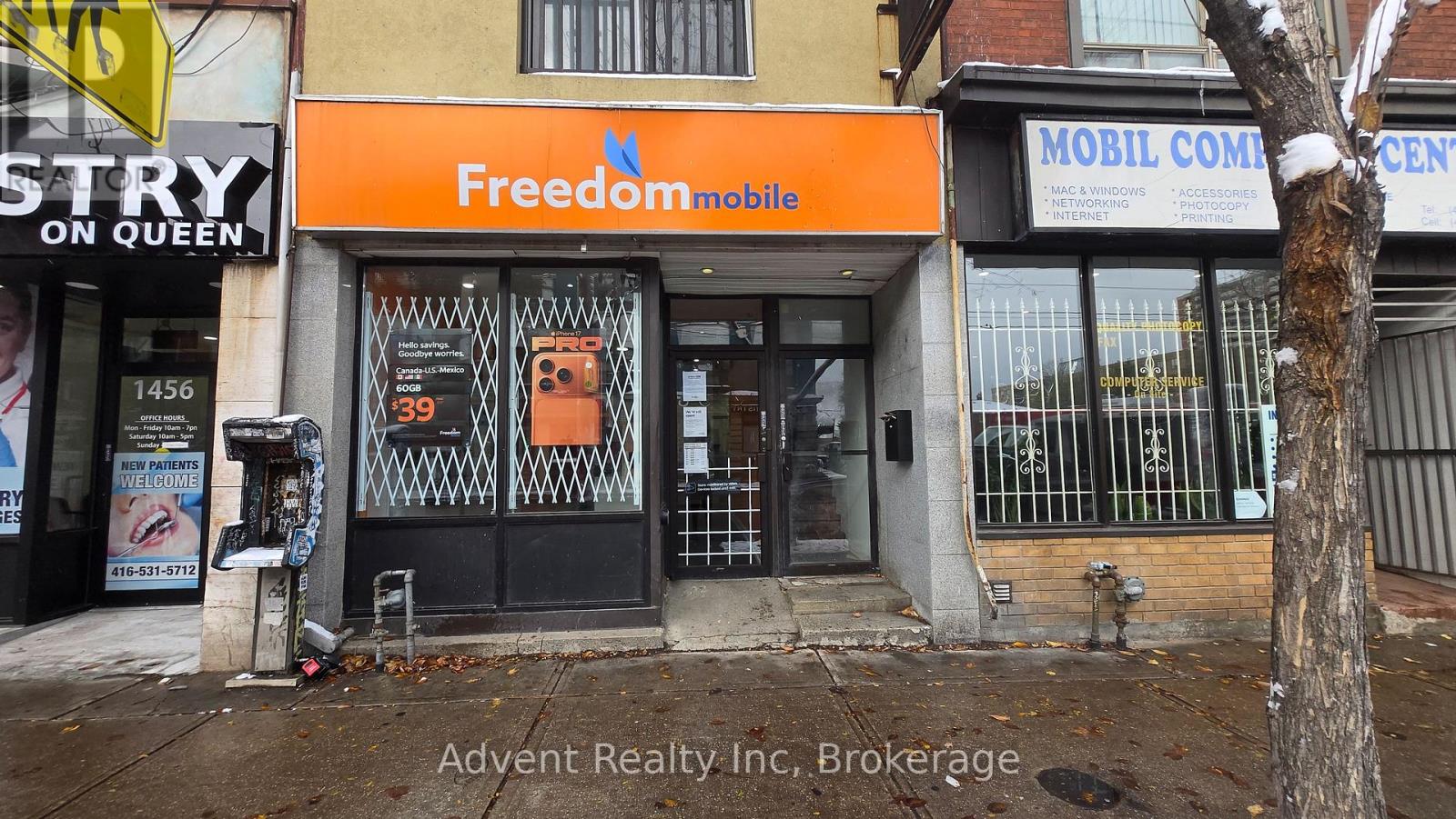 A building with a FreedomMobile sign on the front.