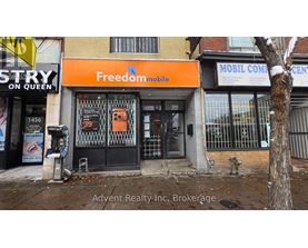 A building with a FreedomMobile sign on the front.