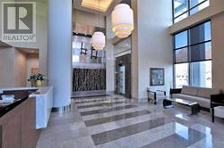 A realtor office with a reception desk and a bench.