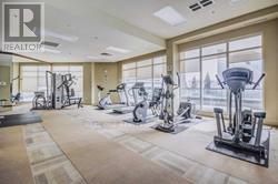 A gym with a variety of exercise equipment including treadmills, stationary bikes, and weight machines.