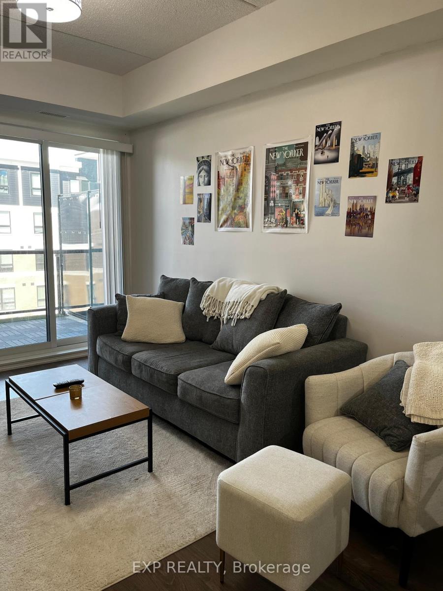 A living room with a grey couch and a coffee table.