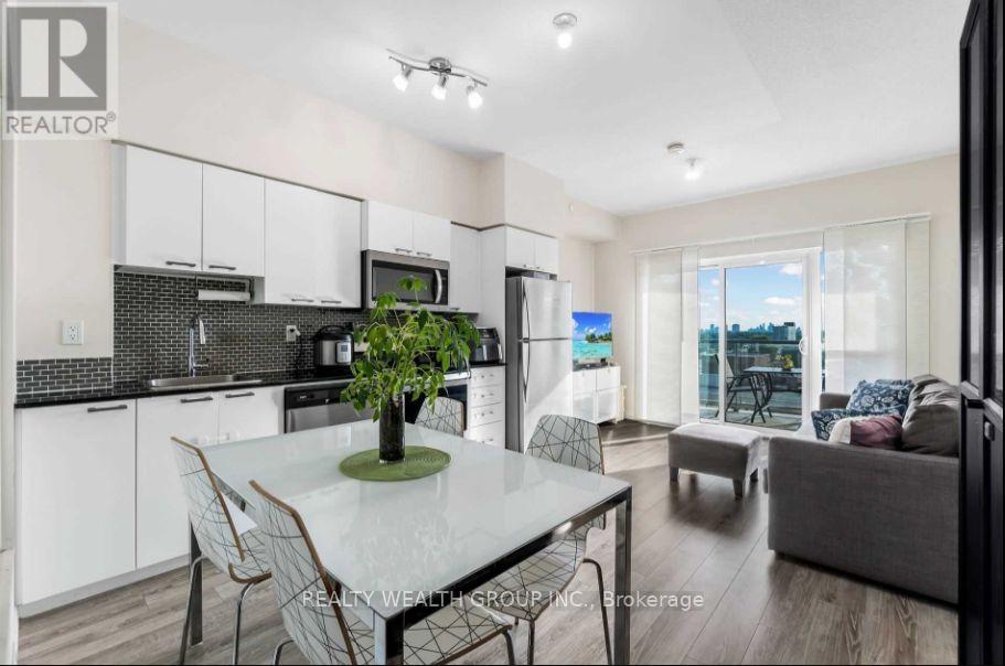 A modern kitchen with a dining table set up.