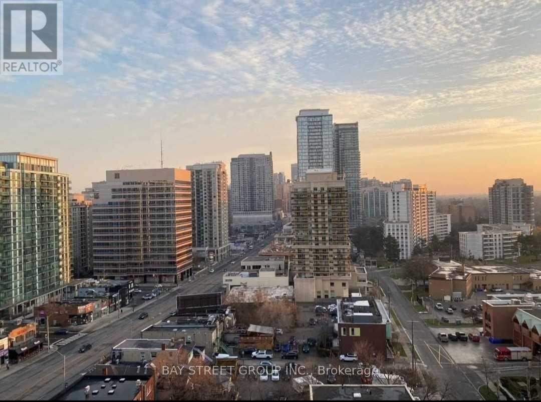 A cityscape with a realtor logo in the corner.