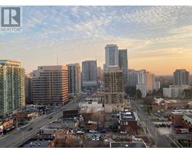 A cityscape with a realtor logo in the corner.