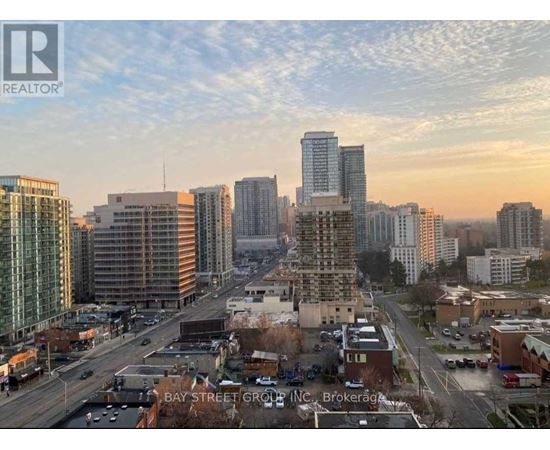 A cityscape with a realtor logo in the corner.
