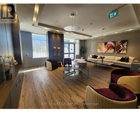 A modern living room with a wooden floor and a large window.