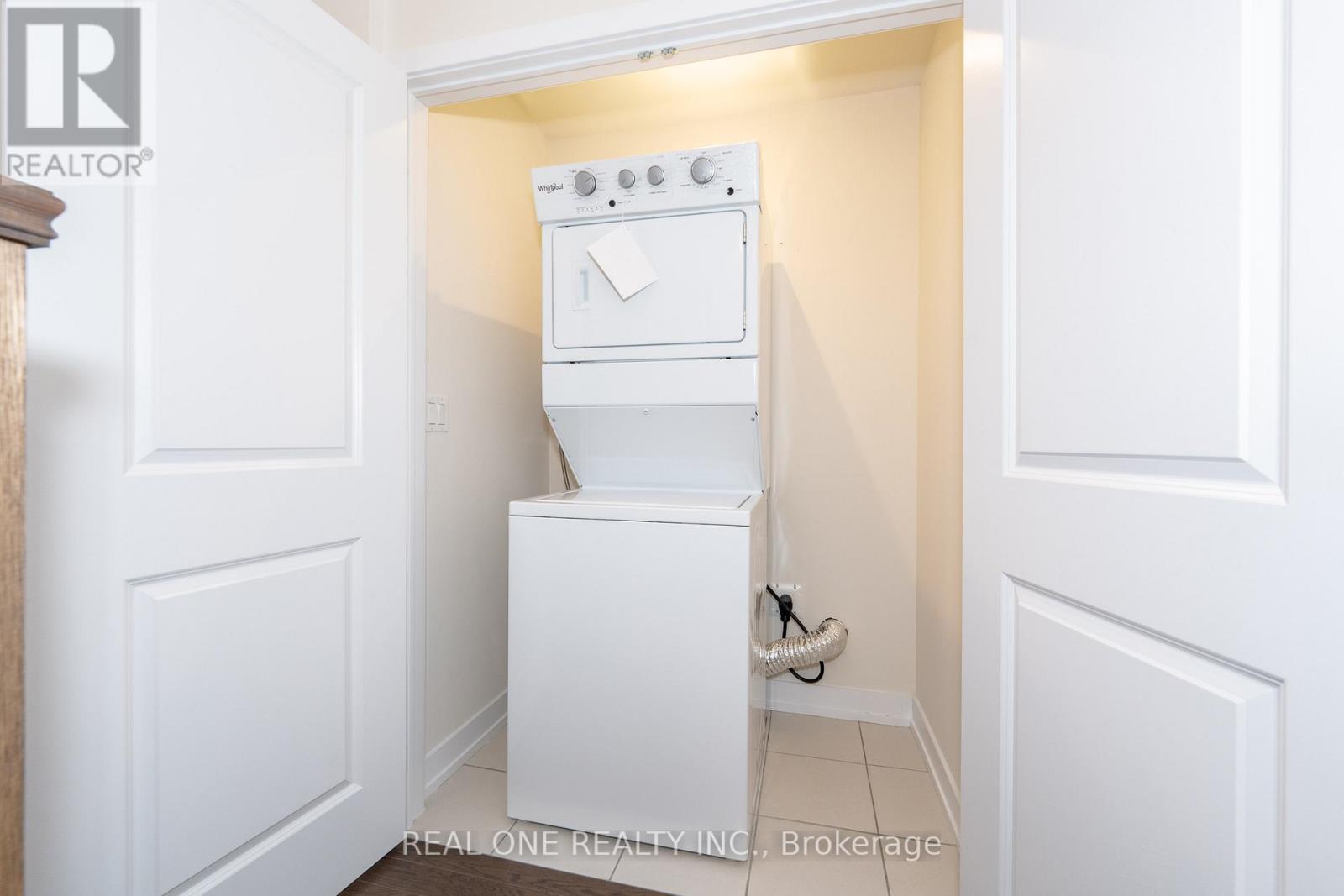 A white oven and dishwasher in a small kitchen.
