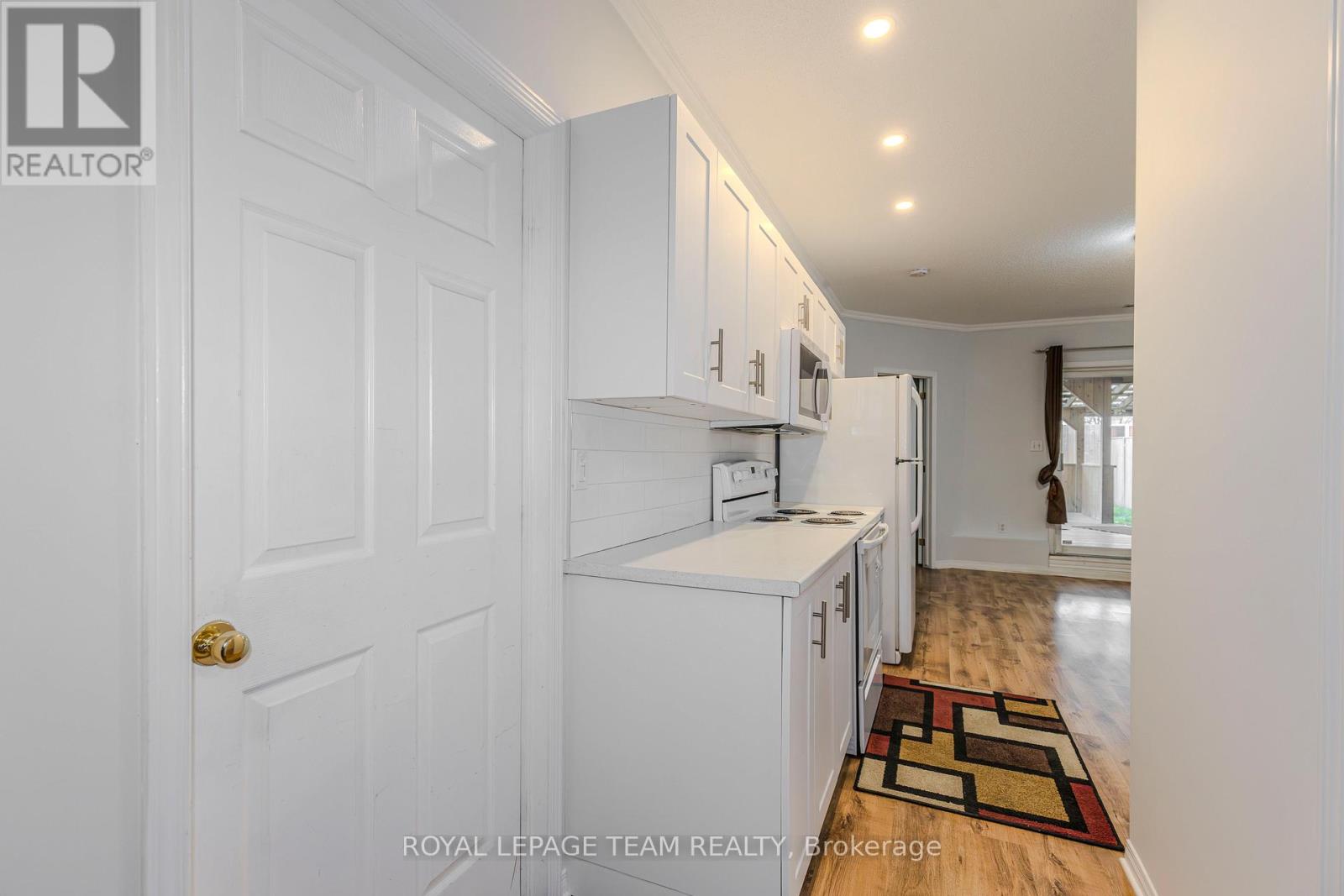 A white door with a Royal LePage Team Realty logo on it.