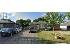A street view of a residential area with cars parked and a house with a sign "HOMELIFE LANBREAK REALTY INC. BIRKENHEAD".