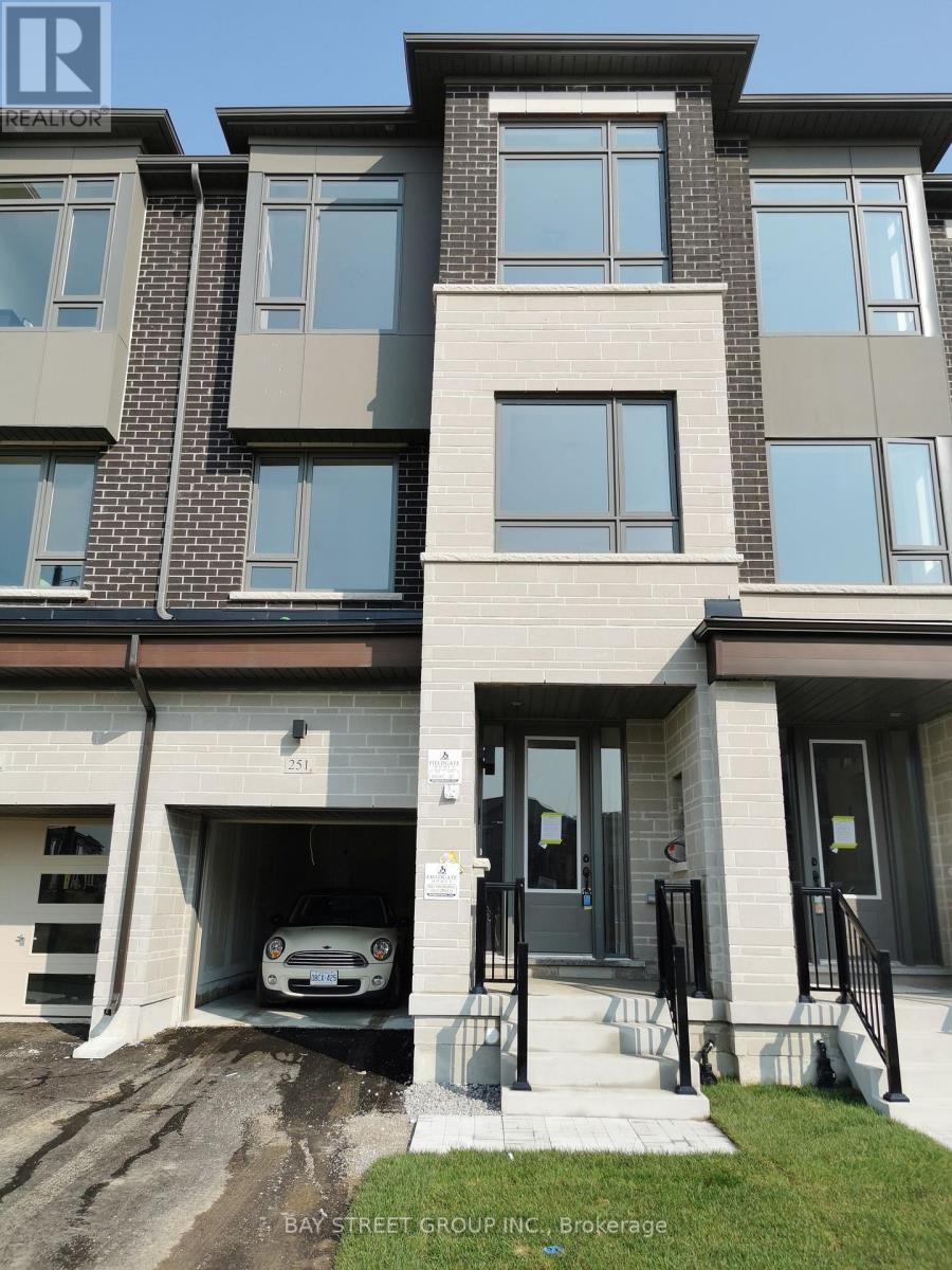 A modern two-story building with a garage under the entrance.