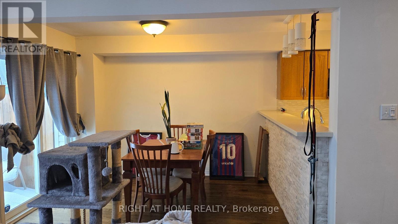 A cozy dining area with a table and chairs.