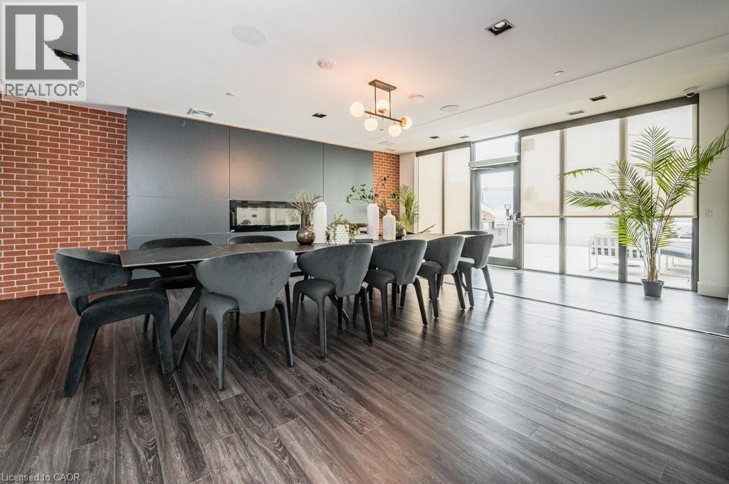 A modern dining room with a wooden table and chairs.