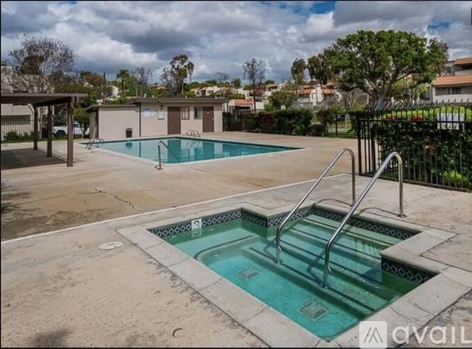 A pool with a slide in the middle of it.