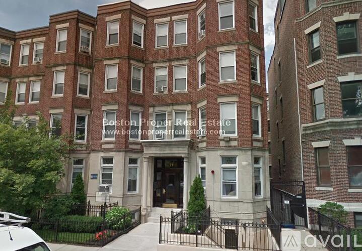A building with the text "Boston Property Estate" on it.