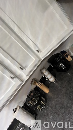 A kitchen counter with a toaster and a coffee maker on it.
