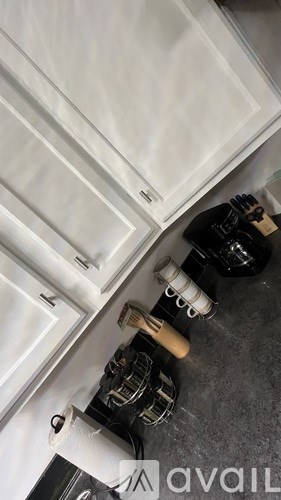 A kitchen counter with a toaster and a coffee maker on it.