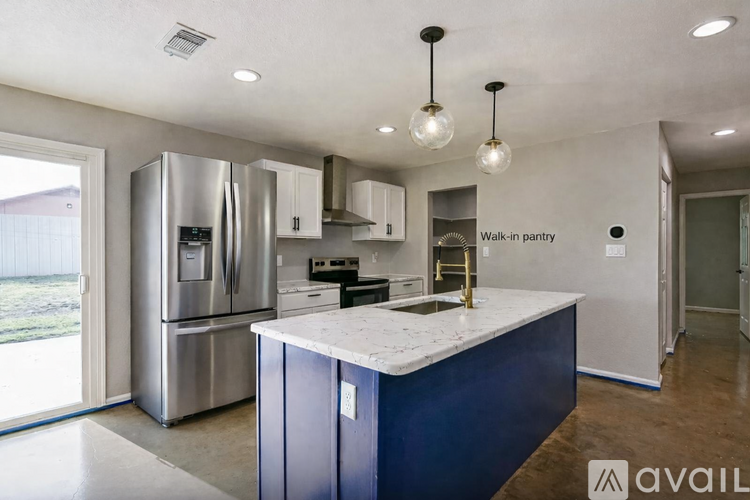 A kitchen with a walk-in pantry.