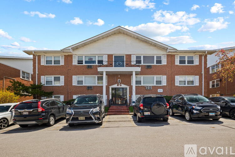A building with a parking lot in front of it.