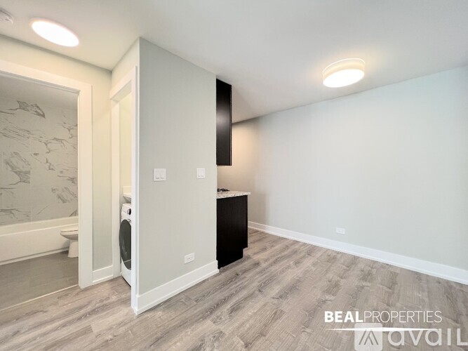 A room with a washer and dryer in it.