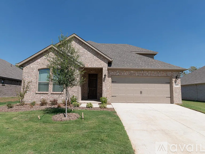 A house with a garage and a driveway.