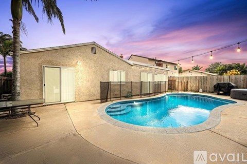 A house with a pool in the backyard.