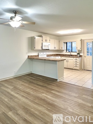 A kitchen with a countertop and cabinets.
