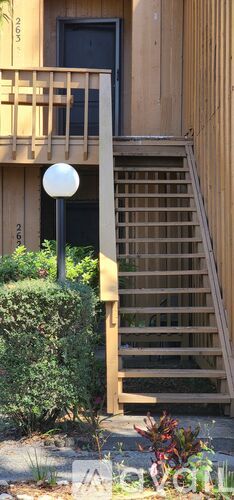 A building with a staircase leading to the second floor.