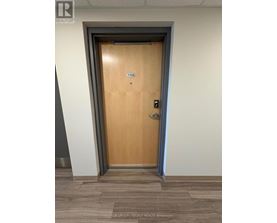 A brown door with the number 1104 on it.