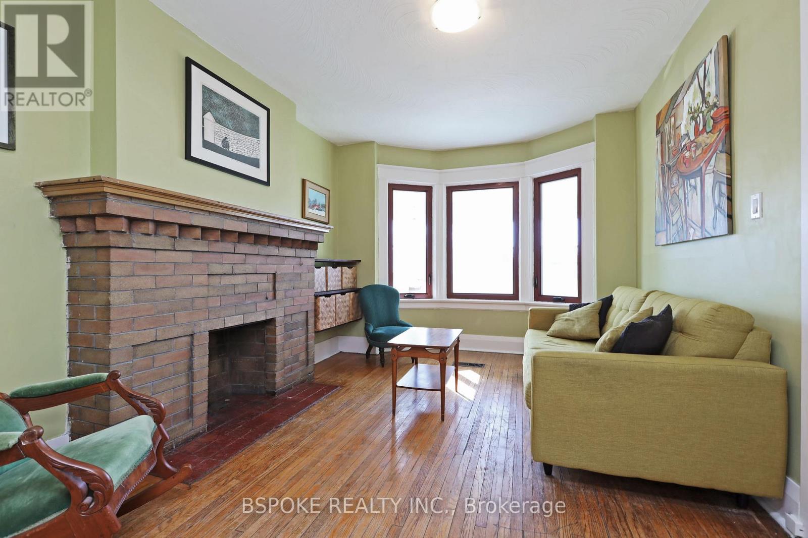 A living room with a fireplace and a couch.