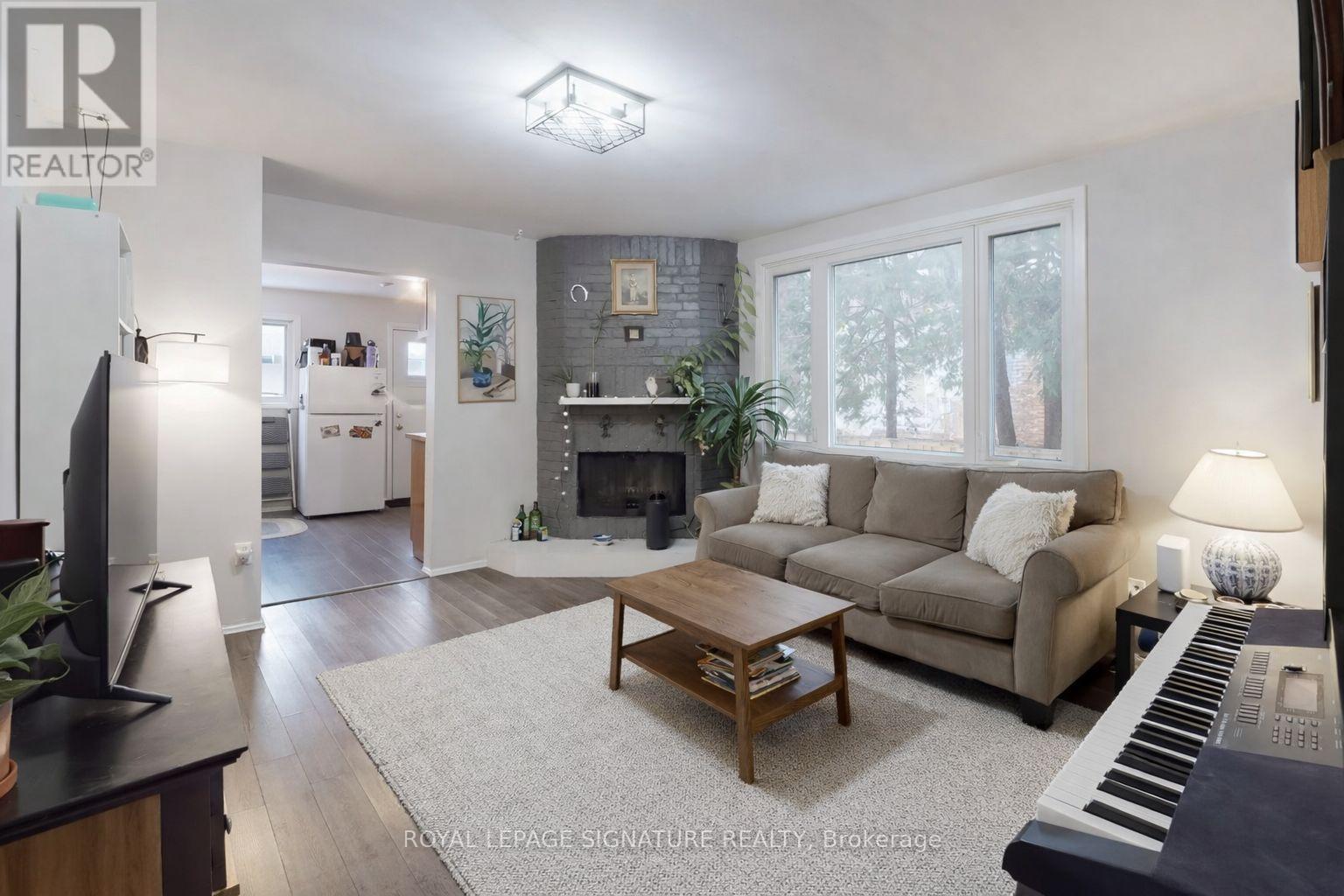 A living room with a piano and a couch.