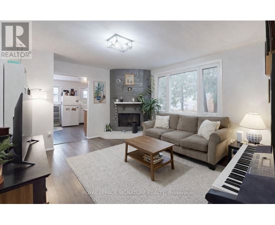 A living room with a piano and a couch.