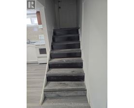 A set of stairs leading up to a door.