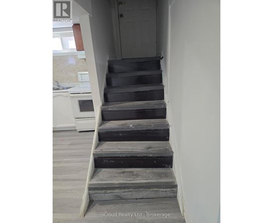A set of stairs leading up to a door.