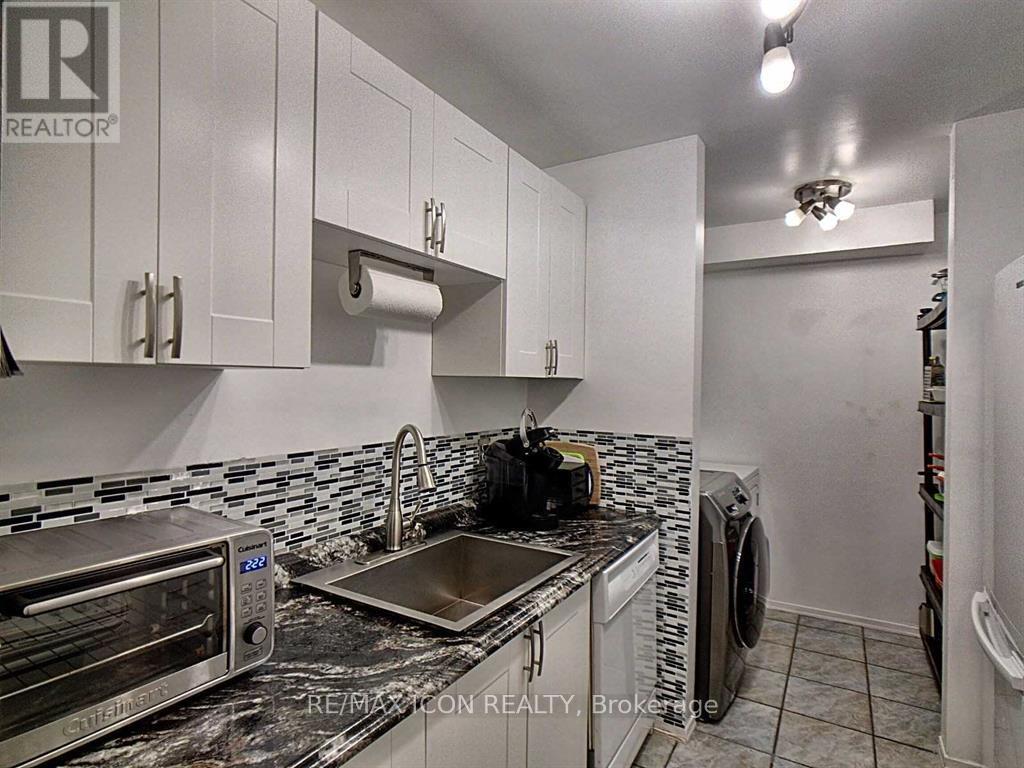 A kitchen with a stove top oven, microwave, and dishwasher.
