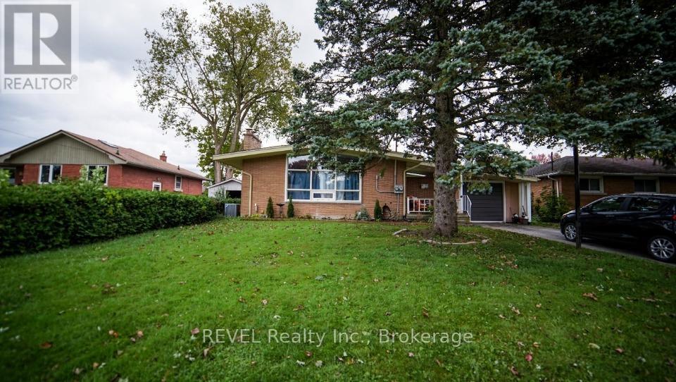 A house with a lawn in front of it is for sale.