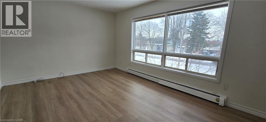 A room with a window showing a snowy landscape outside.