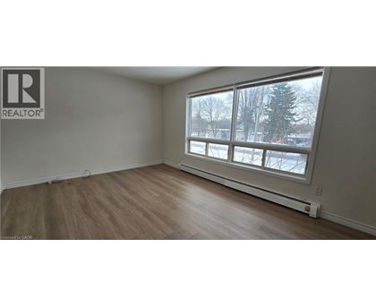 A room with a window showing a snowy landscape outside.