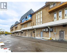 A building with a sign that says Forest Hill Real Estate Inc. Brokerage.
