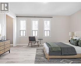 A bedroom with a bed, chair, and a dresser.