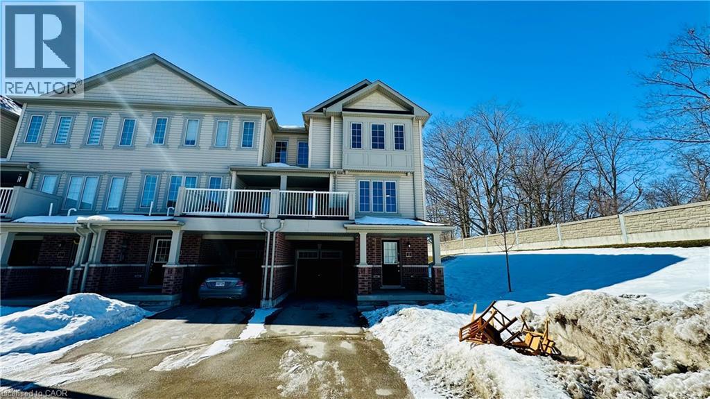 A large house with a car parked in the driveway.