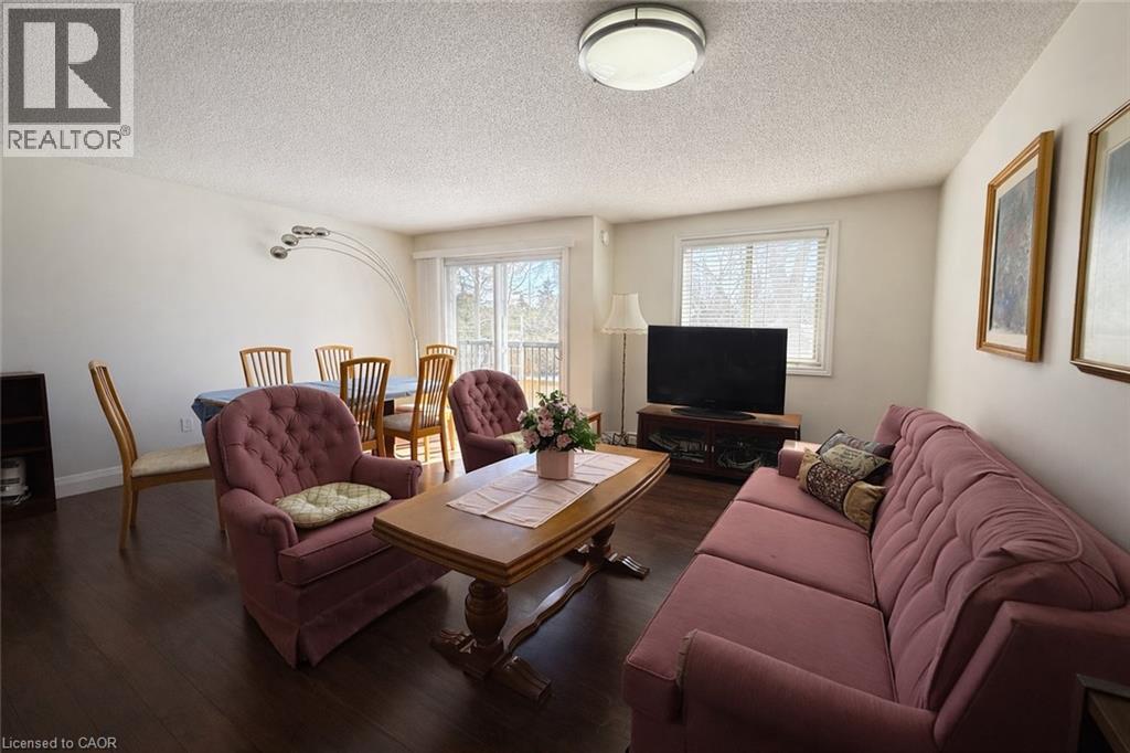A living room with a brown couch and a wooden coffee table.
