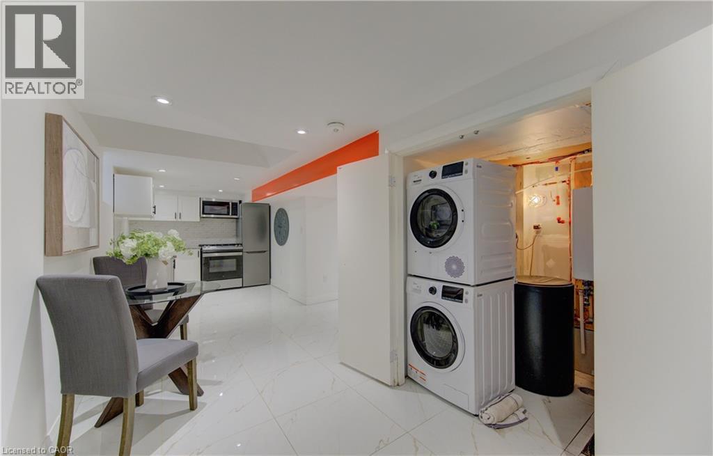 A modern kitchen with a dining table and chairs.