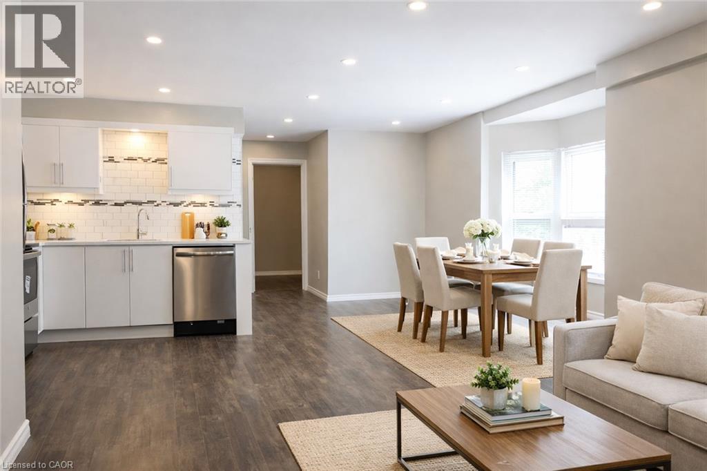 A well-lit, modern kitchen with a dining area in the background.