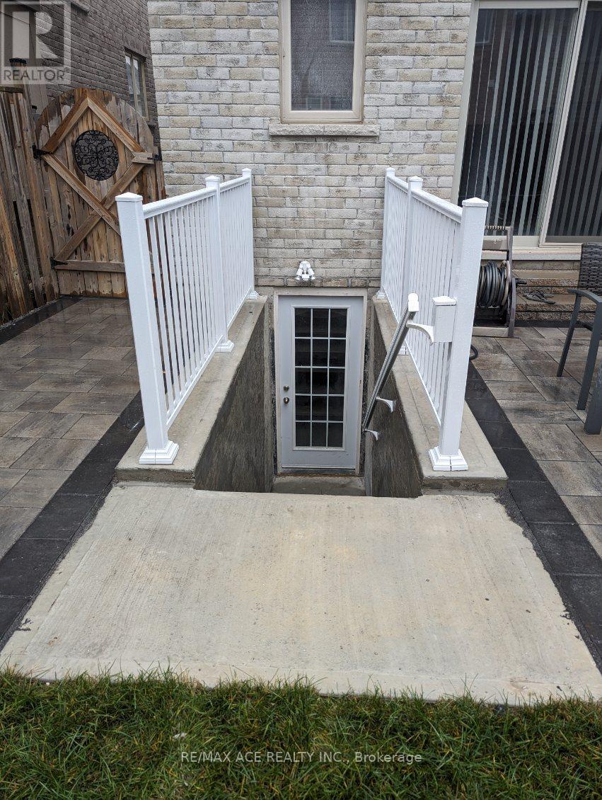 A small white fenced area with a door in the middle.