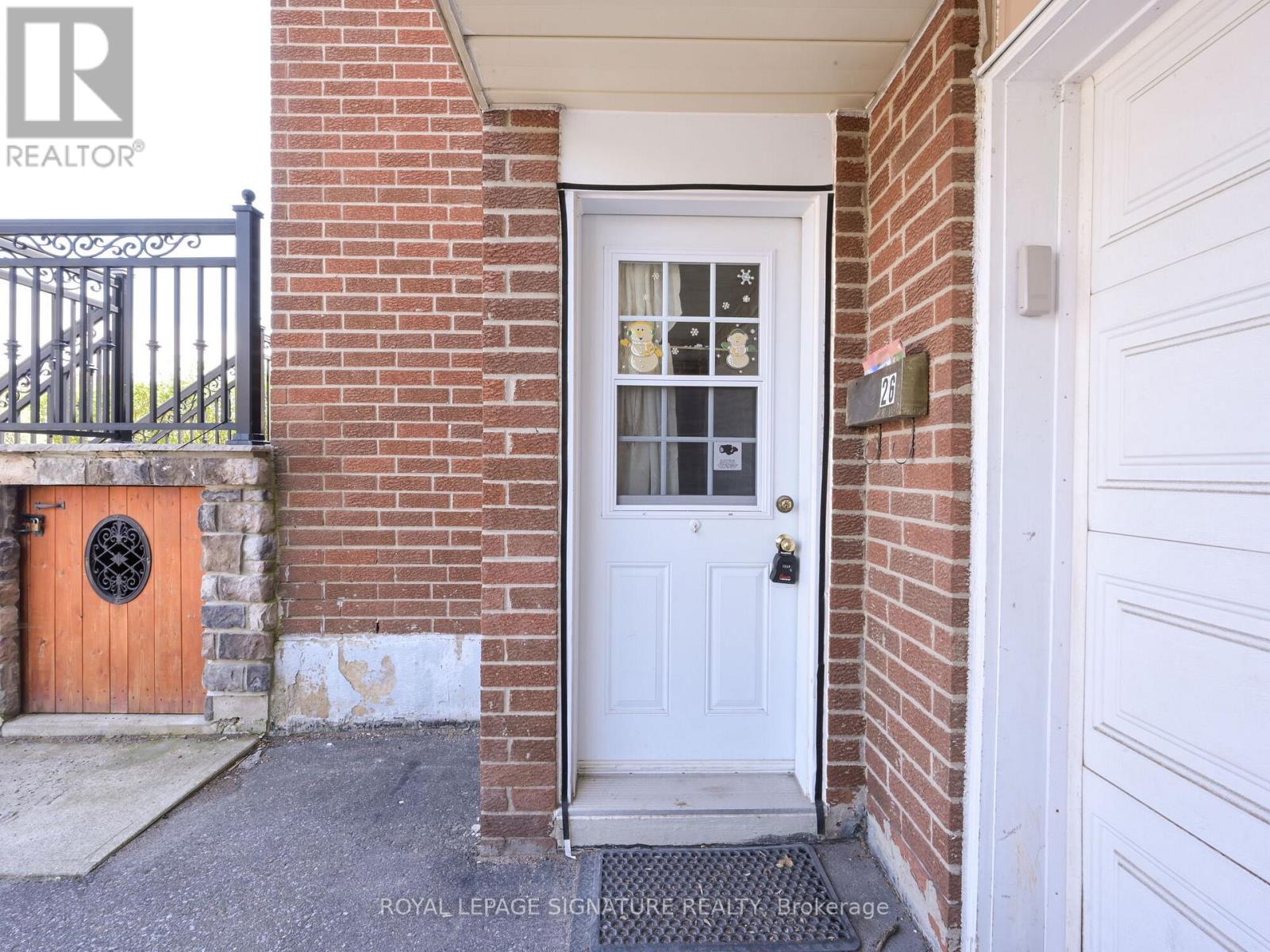 A white door with a glass window is the main focus of the image.
