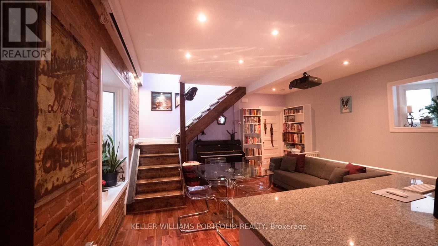 A living room with a staircase leading to the upper floor.